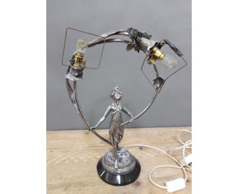 An Art Deco chrome table lamp modelled as a semi nude female figure holding a wreath of flowers, height 46cm Condition - brok