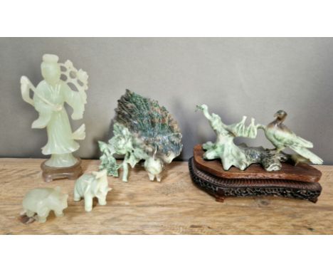 A group of 4 carved jade items, large piece is broken in 2.Condition:- General wear throughout, 2 elephant tusks missing, som