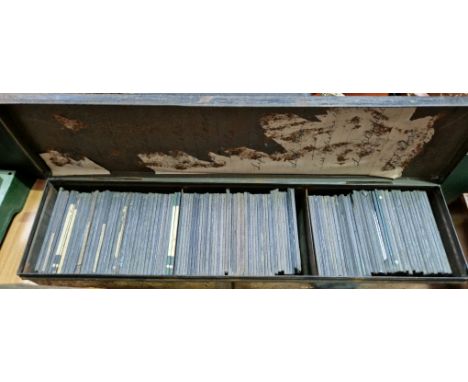 A tin containing a collection of old glass photographic magic lantern slides, mostly travel, architectural etc. 