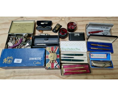 A box of collectables including Paper Mate pens, Parker pens, Royal memorabilia including tin money box, a Hohner harmonica, 