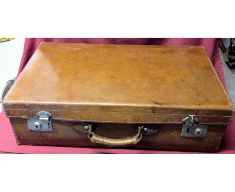 A vintage brown leather Suitcase, 26" (66cms) wide.