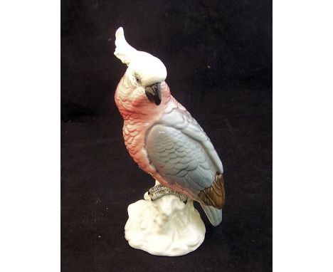 A Beswick Model of a Cockatoo no 1180 in pink and grey gloss, withdrawn 1975.
