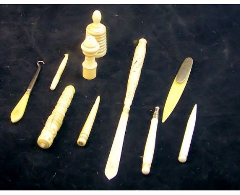 A number of bone and ivory Ornamental Items including letter opener, pipe tamper, needle case, etc.