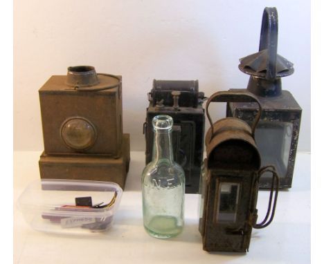 A German black Japanned Railway Lantern, other railway lamps, an LNER glass bottle and a number of railway badges.