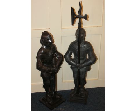 Two knight fireside companions, one with a sword, the other with an axe, 88cm high, and a three light wrought iron standard l