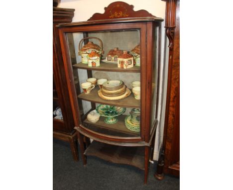 An Edwardian inlaid mahogany bow front glazed display cabinet on square tapered legs, with under-shelf, 63cm, (NC)