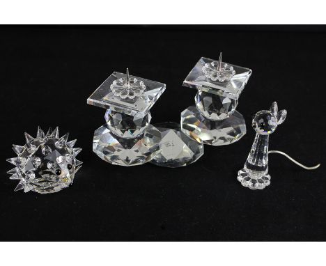 A Swarovski crystal two light candlestick, together with a large Swarovski hedgehog and cat