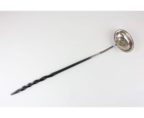 An unmarked silver toddy ladle with George II coin inset, on barley twist whalebone handle (a/f - two parts detached)