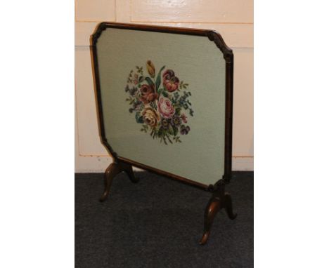 A framed tapestry card table/fire screen, with carved corner detail on curved legs, 70cm by 65cm