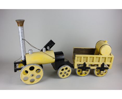 A wooden model toy of a steam train with truck, 67cm long