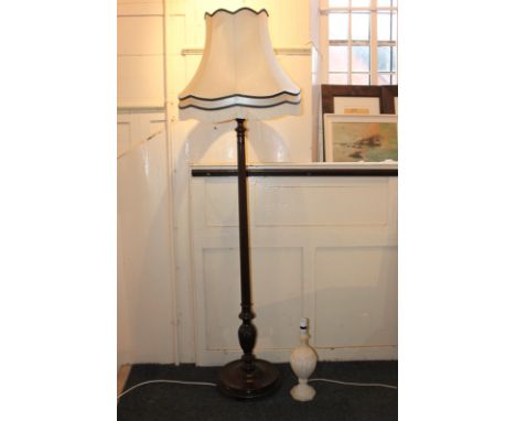 A carved mahogany standard lamp together a carved white stone table lamp (af) and three matching shades