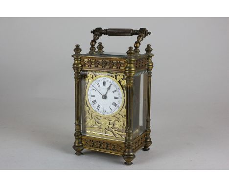 A gilt brass and bevelled glass cased carriage clock, the face marked Mappin & Webb Ltd, with Roman numerals, the surround in