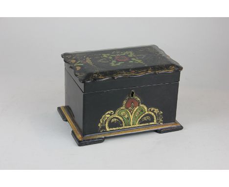 A 19th century black lacquered tea caddy, the scalloped lid with gilt embellishment opening to reveal two galvanised wells wi