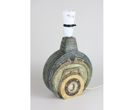A Troika pottery wheel lamp, base decorated differently on both sides, predominantly dark green with shades of brown detail, 