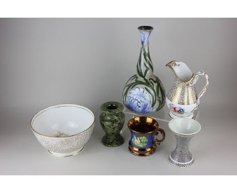 An English pottery bottle neck pottery vase, two bud vases, a lustre ware cup, a gilt decorated jug and basin and a cream war