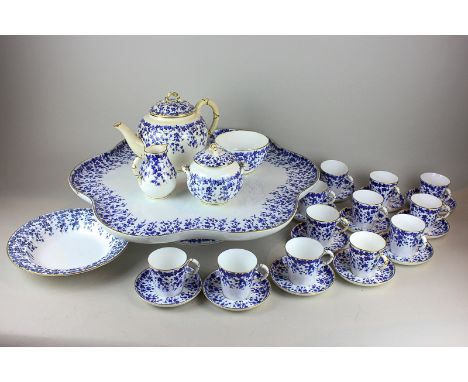 A Royal Worcester blue and white porcelain Lazy Susan tea service, including scalloped shaped Lazy Susan standing on revolvin