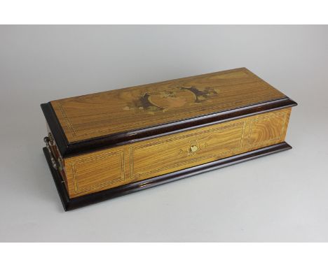 A 20th century Swiss music box with inlaid exterior, mirrored lid and five reels playing five airs, 39cm wide