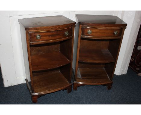 A pair of mahogany bedside cabinets with bow front drawer and shelves, on bracket feet, 42cm