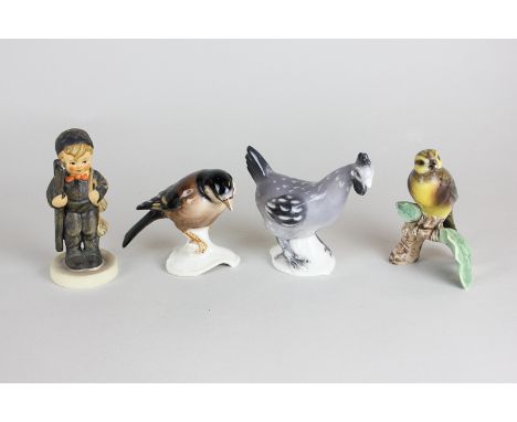 Three Goebel porcelain figures of birds and a Hummel figure of a boy