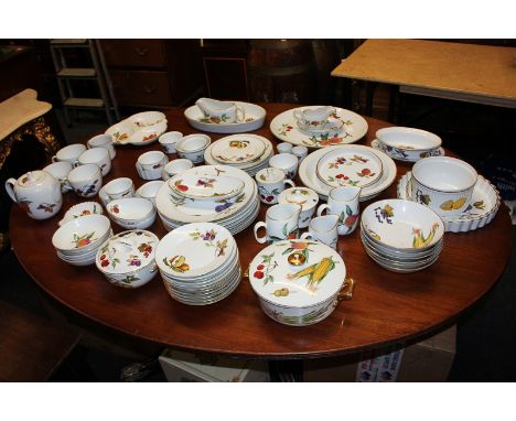 A large collection of Royal Worcester Evesham pattern table ware including serving dishes and tea ware