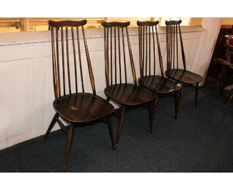 A set of four Ercol oak dining chairs, with five turned back supports, in dark stain (a/f)