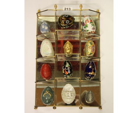 A display shelf with a collection of ornamental eggs, various materials, size 40 x 27cm.