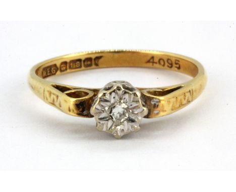 An 18ct yellow gold diamond set solitaire ring, (M.5).