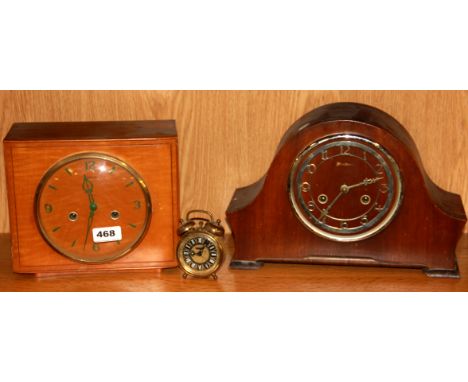 An Art Deco walnut veneered mantle clock together with further mantle clock and an alarm clock.