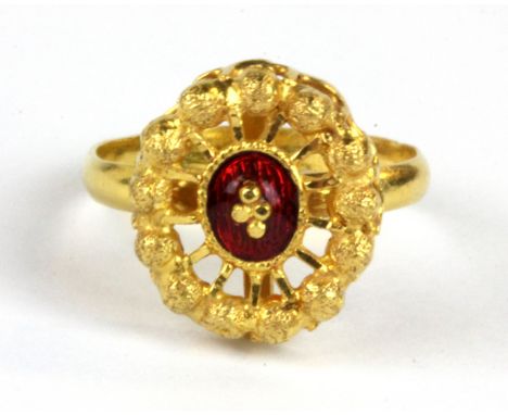 A yellow metal (tested minimum 18ct gold) enamelled ring, W. 3.3g (M).