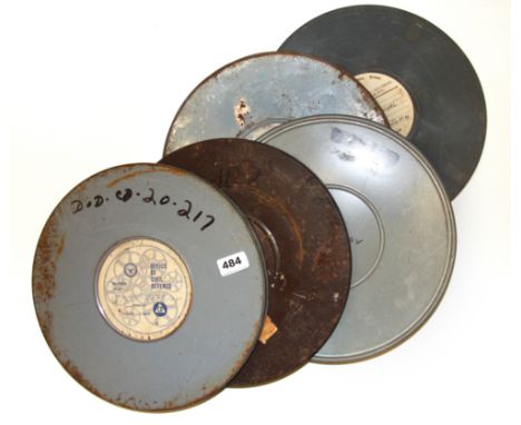 Five vintage cinematic film reels including Office of Civil Defense, 16mm reel Dia. 32cm.