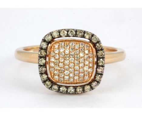 A 14ct rose gold (stamped 14k) diamond set halo ring, (Q).