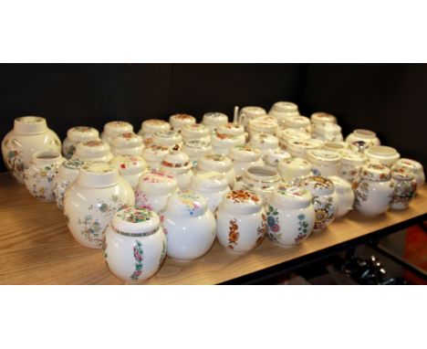 A very large collection of ceramic ginger jars and other pots and covers.