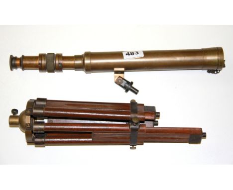 A brass telescope and tripod.
