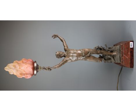 A cast spelter figural table lamp on a red marble base, H. 85cm.