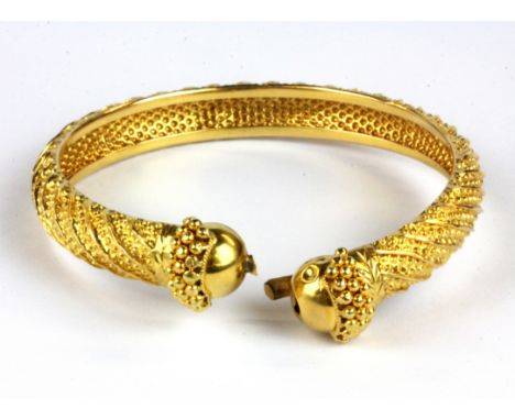 A yellow metal (tested 9ct gold) torque bangle, (a/f) Dia. 7cm.