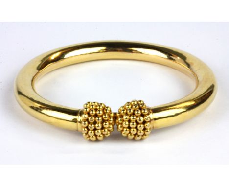 A yellow metal (tested minimum 18ct gold) torque bangle, Dia. 7.5cm W. 34.2g.&nbsp;