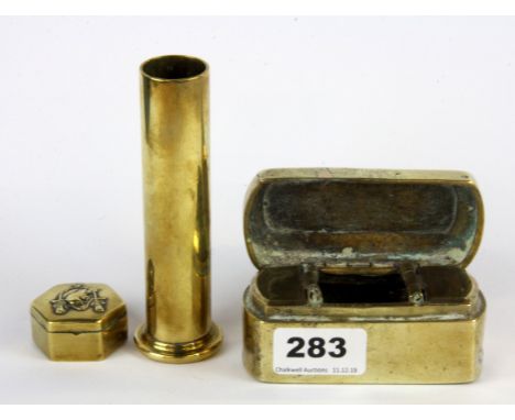 Two brass Trench Art boxes together with a further item.