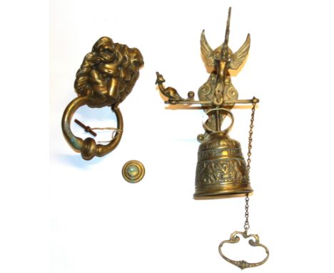 A brass lion door knocker and Angelus bell, knocker H. 20cm.