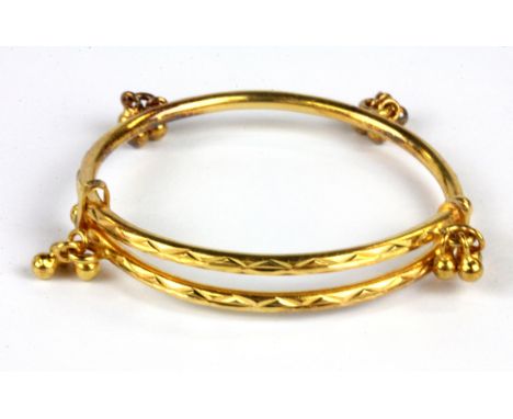A 22ct yellow gold (stamped 22ct) baby bangle, Dia. 4cm W. 7.9g.&nbsp;