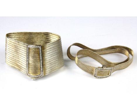 A vintage white metal flexible bracelet and necklace set with stones.