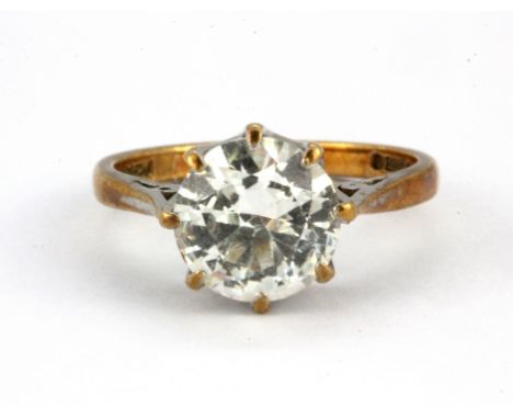 A 9ct yellow gold stone set solitaire ring, (L.5).