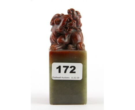 A mid 20th Century Chinese carved mix coloured soapstone scholars seal, H. 12cm.