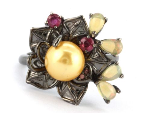 A 925 silver flower shaped ring set with opals, rubies and a cream pearl, (P.5).