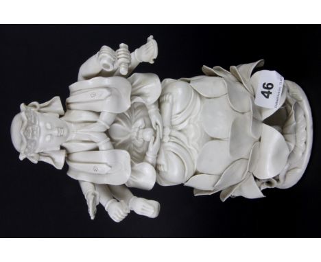 An early 20thC Tibetan blanc de chine glazed ceramic figure of a multi armed deity, H. 26cm.