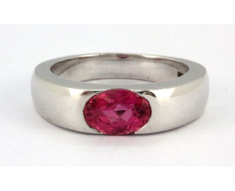 An 18ct white gold ring set with an oval cut pink tourmaline, (H).