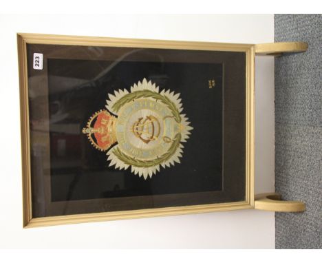 An embroidered Army Service Corps badge made by David Wilkinson in 1918 mounted into a fire screen in the 1960's, size 77 x 4