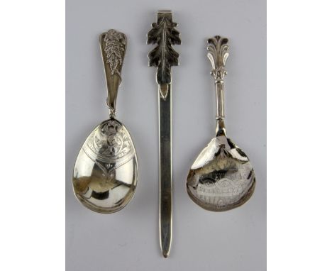 Two silver caddy spoons and a silver book mark.