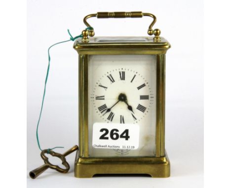 A brass carriage clock, H. 11cm.