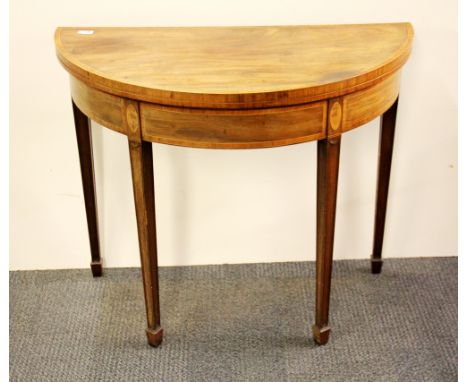 An inlaid mahogany veneered demi lune folding card table, Dia. 91cm.