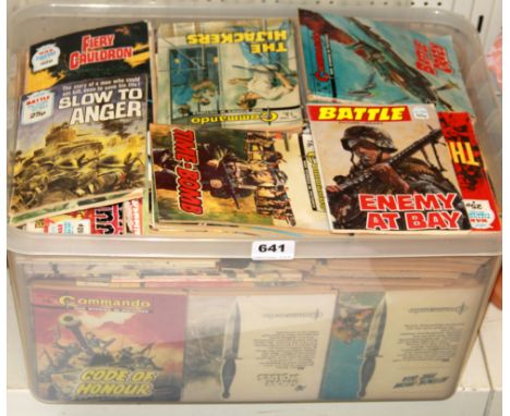 A large box of vintage war comics.